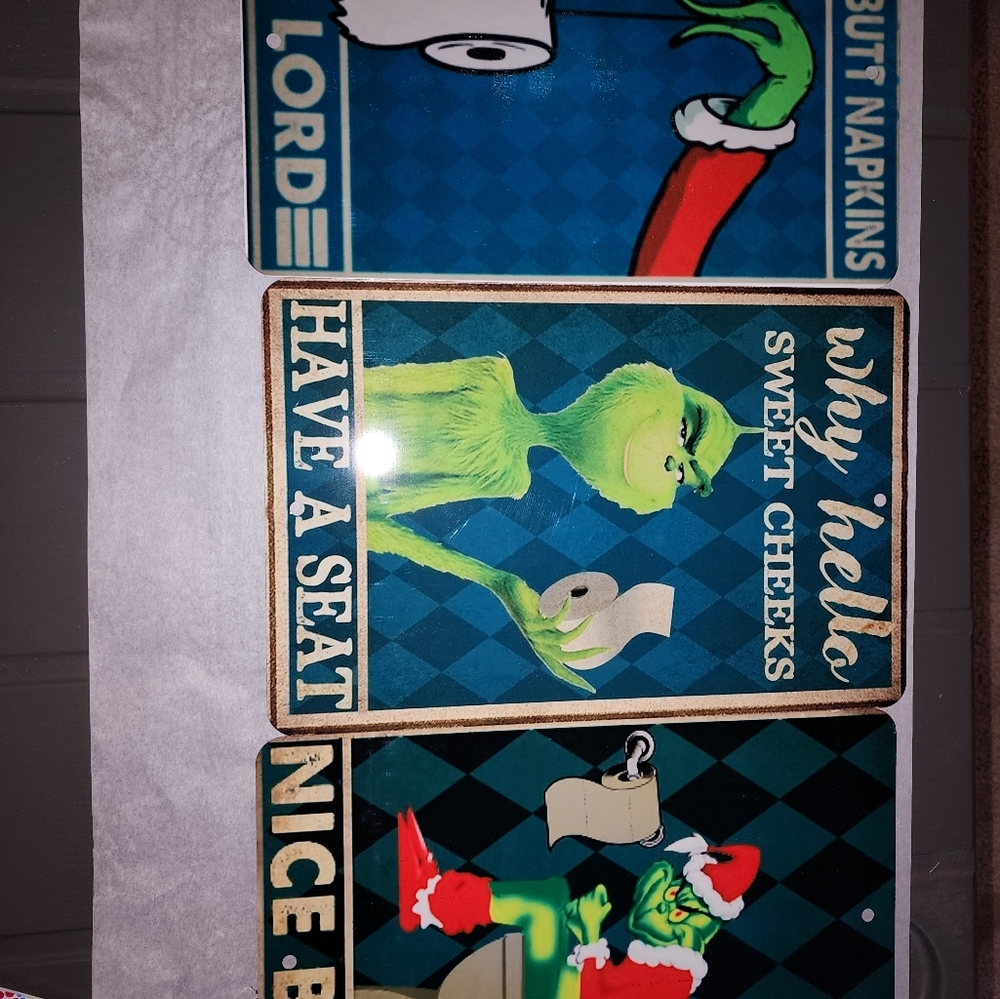 Metal grinch signs